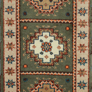 Green Kazak area rug