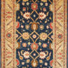 Navy traditional area rug with beige trim